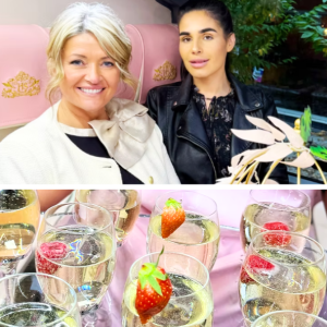 Two elegantly dressed women sipping champagne during an afternoon tea with a twist in Merseyside, part of a women’s social group experience