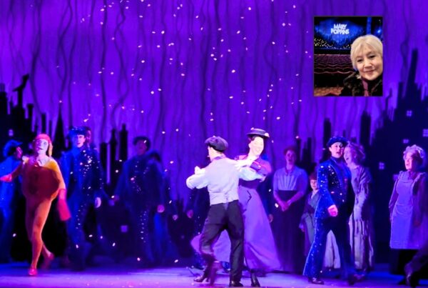 Mary Poppins and Bert dancing on stage.