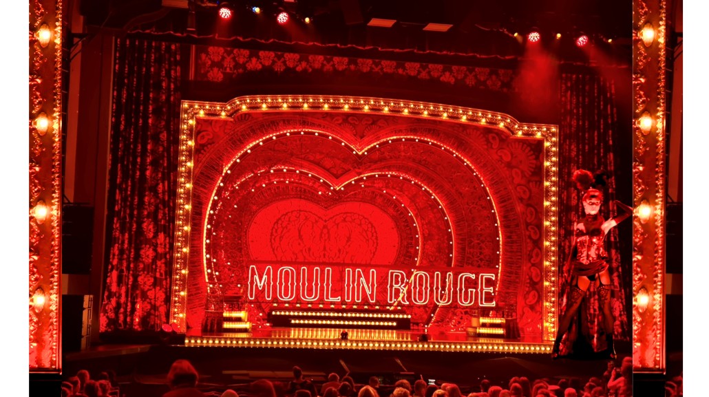 Audience enjoying Moulin Rouge! The Musical live theatre performance.