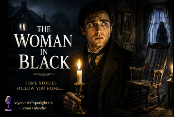 Frightened man holding a candle in the dark in The Woman in Black theatre experience